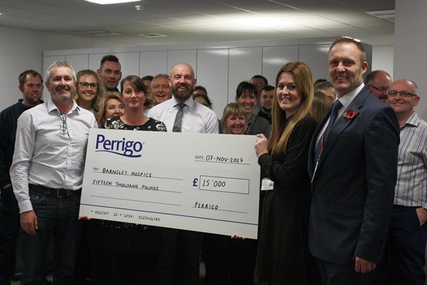 Perrigo staff present cheque to Hospice