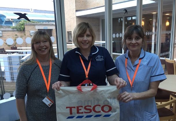 Hospice staff with Tesco bag