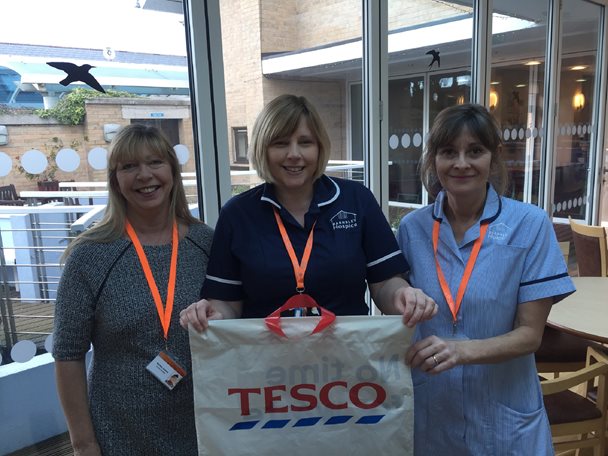 Hospice staff with Tesco bag