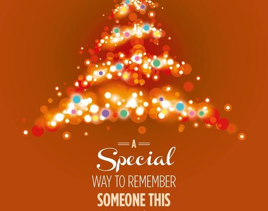 An illustrated image of a Christmas tree on an orange background with the text, A special way to remember someone this Christmas.