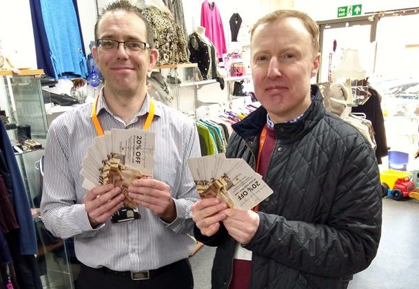 Photo of Paul Cole and Stephen Hatfield holding discount vouchers