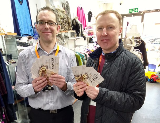 Photo of Paul Cole and Stephen Hatfield holding discount vouchers
