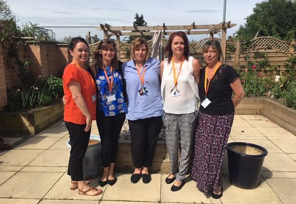 Photo of four ladies standing in the Barnsley Hospice garden