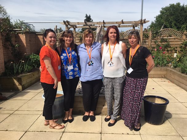 Photo of four ladies standing in the Barnsley Hospice garden