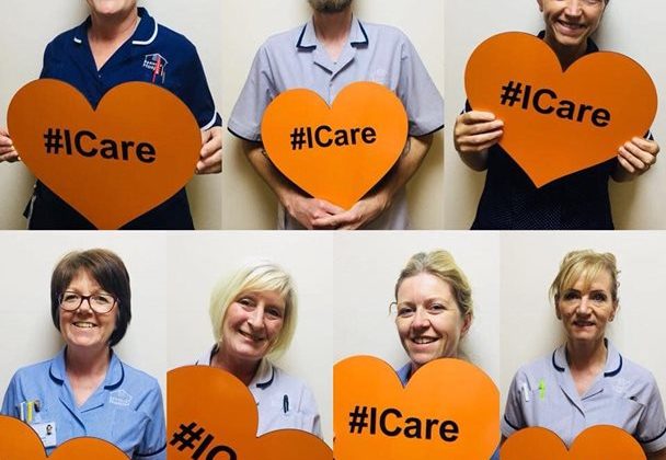 A photo montage of the nursing staff at Barnsley Hospice holding heart shaped signs which read I Care