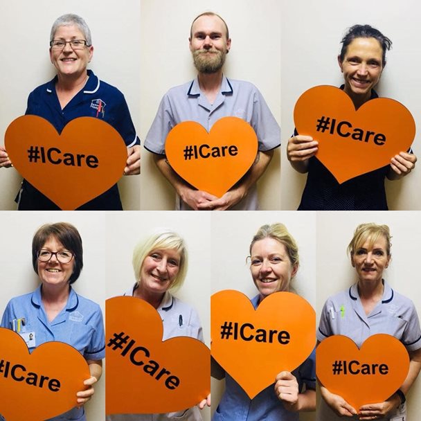 A photo montage of the nursing staff at Barnsley Hospice holding heart shaped signs which read I Care