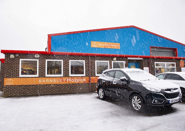 Photo of the exterior of the Barnsley Hospice retail hub on a snowy day