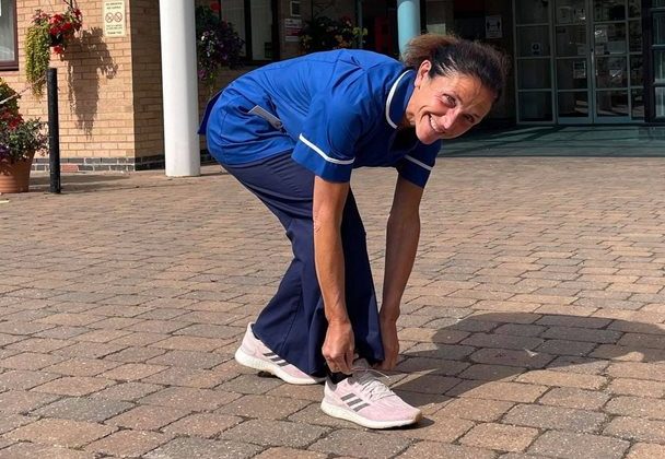 Photo of Zoe fastening the lace on her running shoes