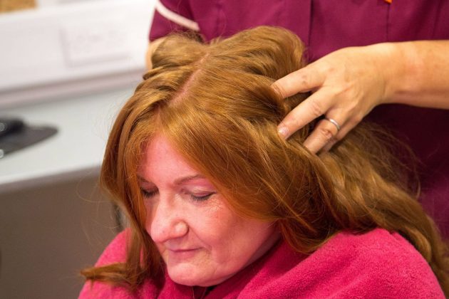 Photo of a lady having a head message