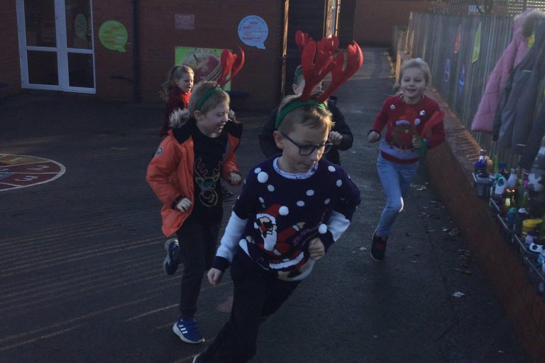 A photo of children from Holy Rood school taking part in the fun run