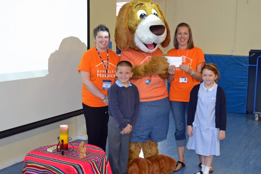 Schoolchildren present their donation to Barnsley hospicee