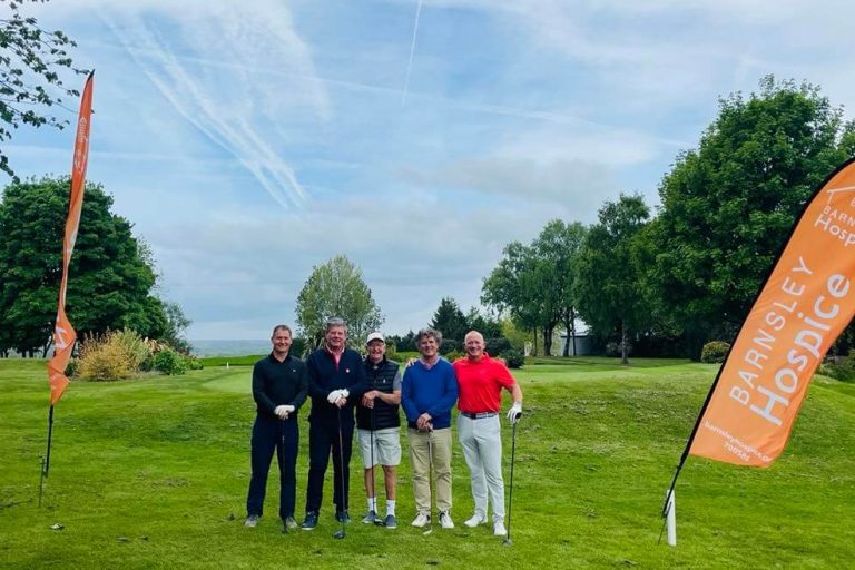 The event sponsors, Lifetime, with Barnsley FC legend Barry Murphy. The five men are stood on the golf course with Barnsley Hospice flags.