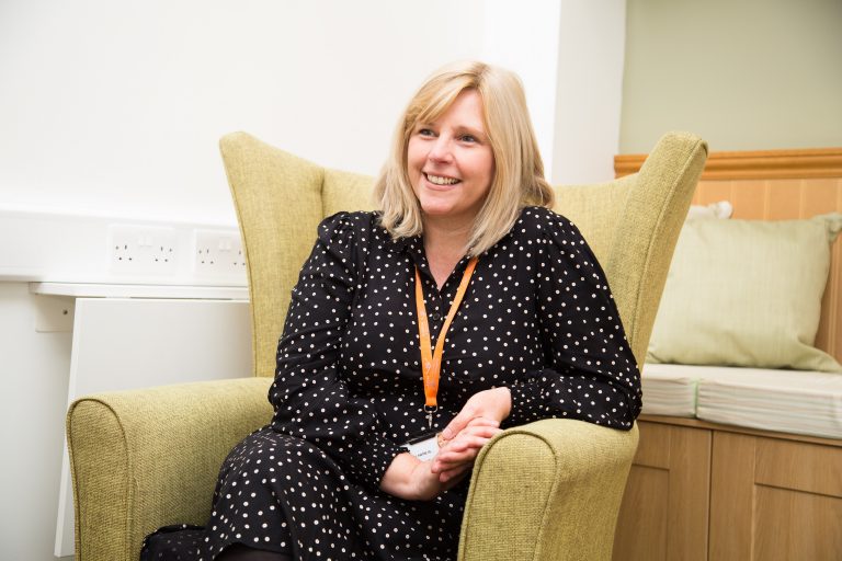 Photo of a member of the counselling team at Barnsley Hospice seated in the counselling suite