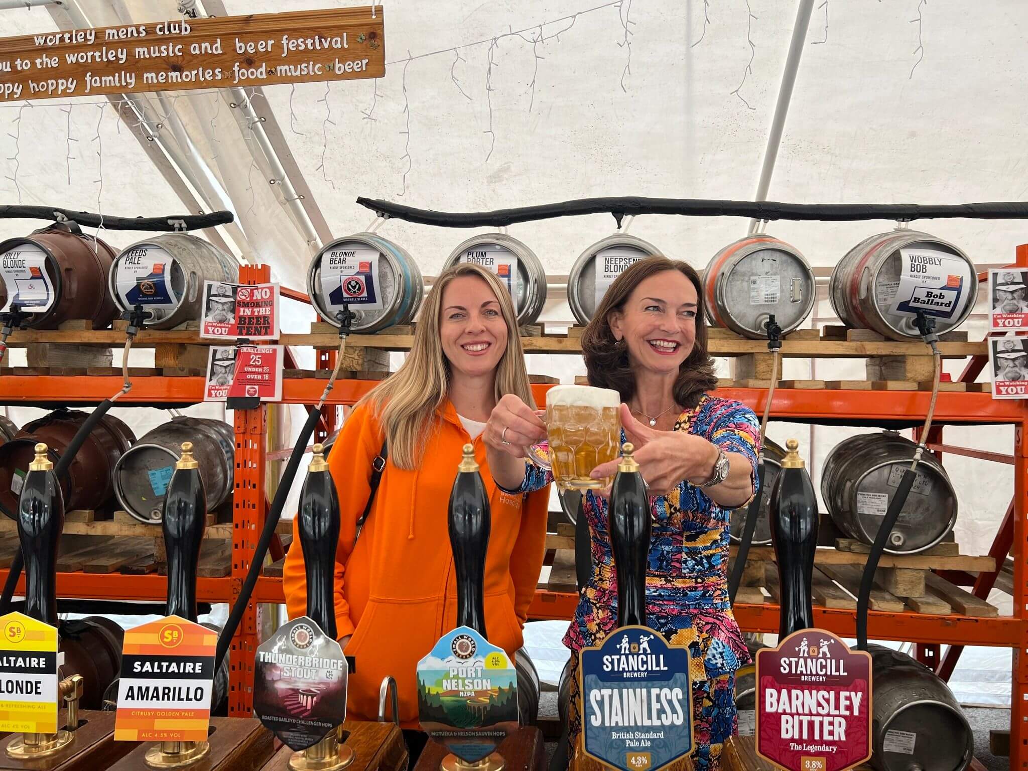 Lady Rowena and Vicky Stead smiling behind the bar