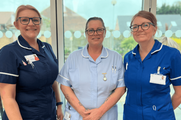 A photo of three nurses smiling
