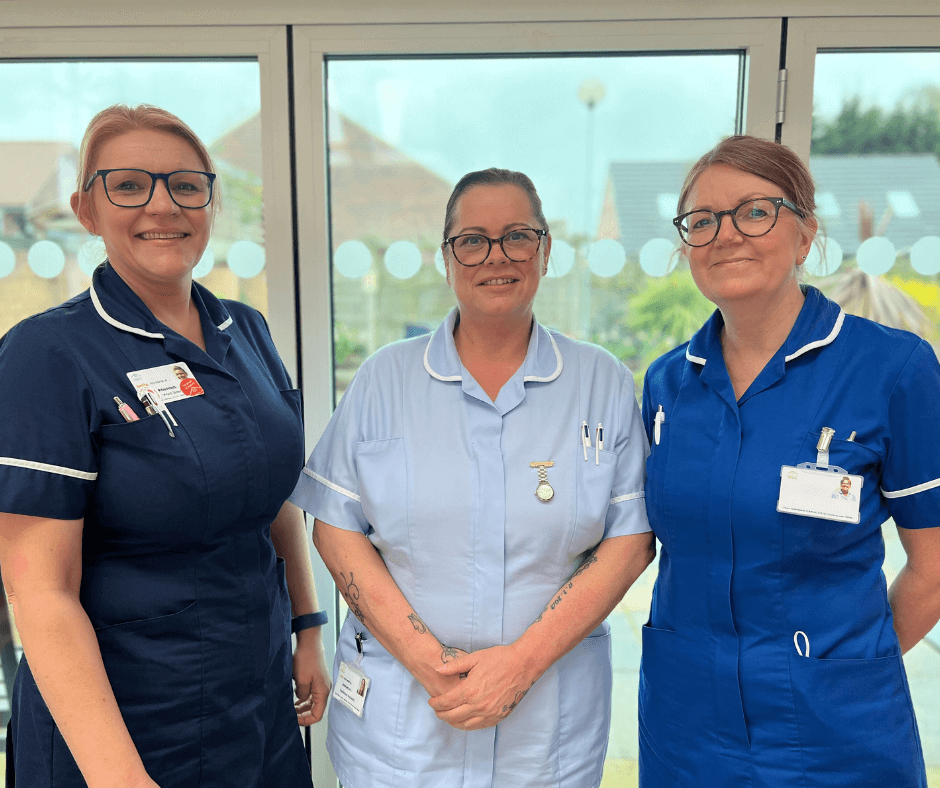 A photo of three nurses smiling